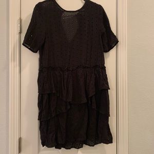 Black poka dot shirt.